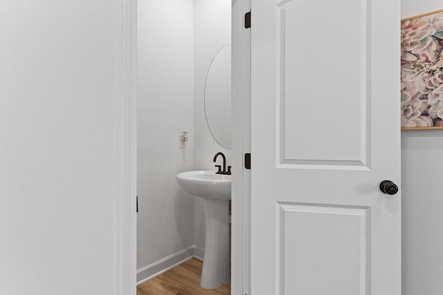 8524 Turnbull Dr, Pleasant View, TN 37146 - bathroom with wood finished floors, baseboards, and a sink