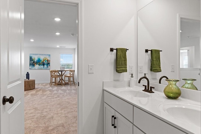 8524 Turnbull Dr, Pleasant View, TN 37146 - bathroom featuring double vanity, recessed lighting, and baseboards