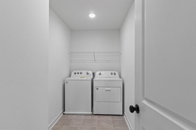 8524 Turnbull Dr, Pleasant View, TN 37146 - washroom featuring washing machine and dryer, light tile patterned floors, and baseboards