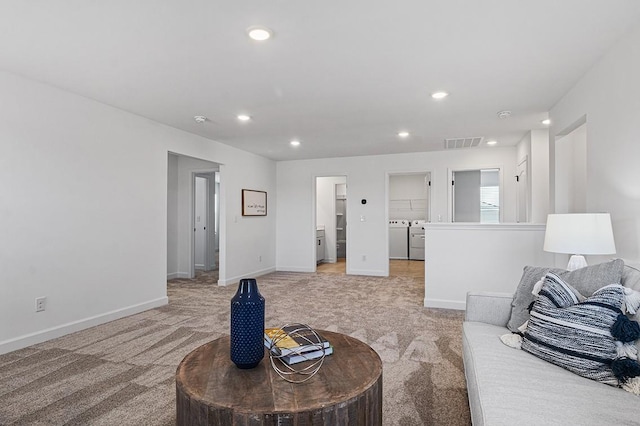8524 Turnbull Dr, Pleasant View, TN 37146 - living area with light carpet, washer and dryer, recessed lighting, and baseboards