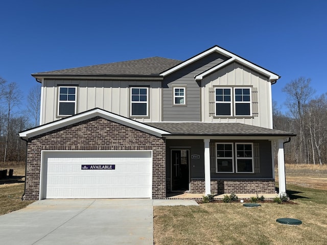 8583 Turnbull Dr, Pleasant View, TN 37146 - view of front of home featuring a porch, an attached garage, board and batten siding, concrete driveway, and brick siding