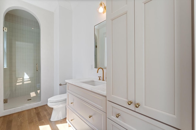 2109 10th Ave S, Nashville, TN 37204 - bathroom with vanity, a stall shower, toilet, and wood finished floors