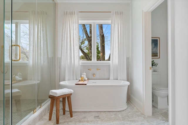 2109 10th Ave S, Nashville, TN 37204 - full bathroom with a freestanding tub, baseboards, toilet, a shower stall, and marble finish floor