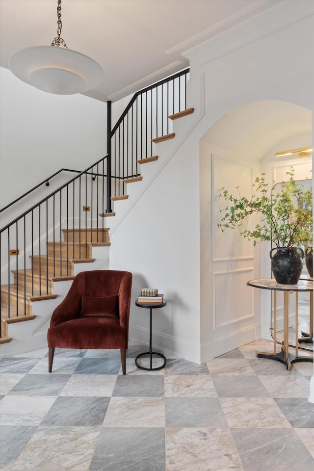 2109 10th Ave S, Nashville, TN 37204 - stairway with a decorative wall, baseboards, and arched walkways