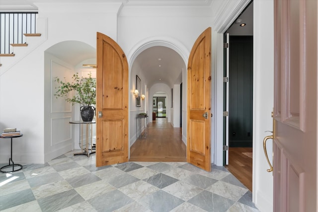 2109 10th Ave S, Nashville, TN 37204 - hallway featuring crown molding, stairway, and arched walkways