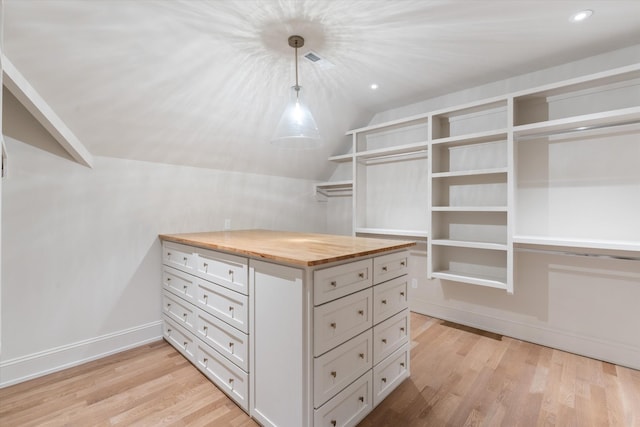 2109 10th Ave S, Nashville, TN 37204 - walk in closet featuring light wood finished floors and lofted ceiling