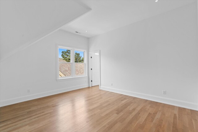 2109 10th Ave S, Nashville, TN 37204 - additional living space featuring light wood-type flooring, visible vents, baseboards, and vaulted ceiling