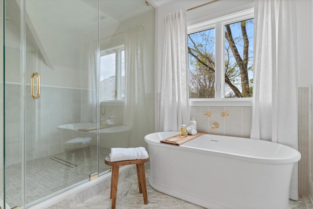 2109 10th Ave S, Nashville, TN 37204 - bathroom featuring a shower stall, a freestanding bath, and a healthy amount of sunlight