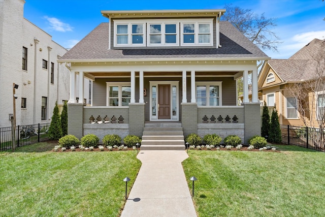 2109 10th Ave S, Nashville, TN 37204 - view of front of house with roof with shingles, covered porch, a front yard, and fence