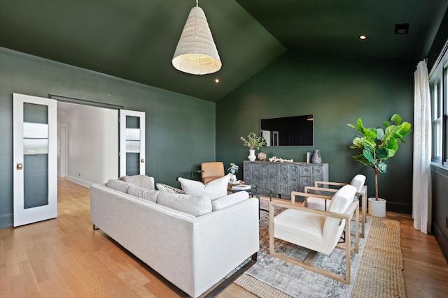 2109 10th Ave S, Nashville, TN 37204 - living room with high vaulted ceiling, baseboards, and wood finished floors