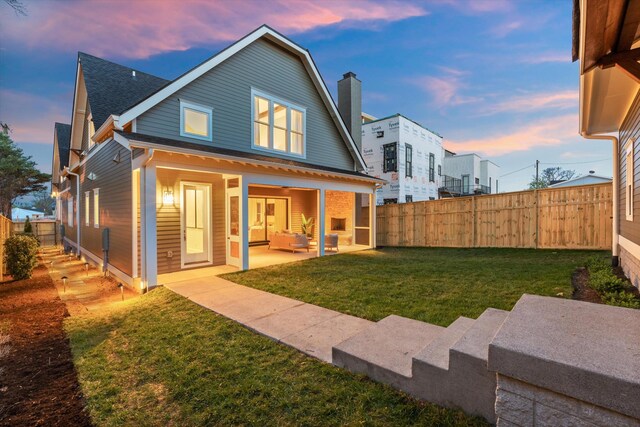 2109 10th Ave S, Nashville, TN 37204 - back of property with a yard, a patio, and a fenced backyard