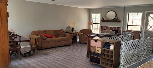1124 Woodlawn Shores Rd, Sugar Tree, TN 38380 - living room with crown molding, baseboards, wood finished floors, and a fireplace