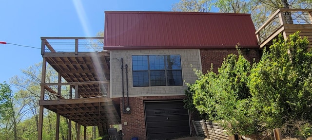 1124 Woodlawn Shores Rd, Sugar Tree, TN 38380 - view of front of property with an attached garage, metal roof, and brick siding