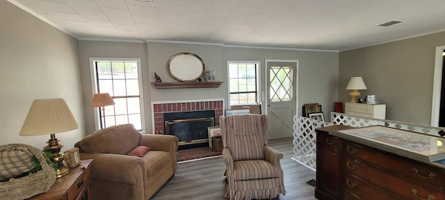 1124 Woodlawn Shores Rd, Sugar Tree, TN 38380 - interior space featuring a fireplace, dark wood-type flooring, visible vents, and ornamental molding