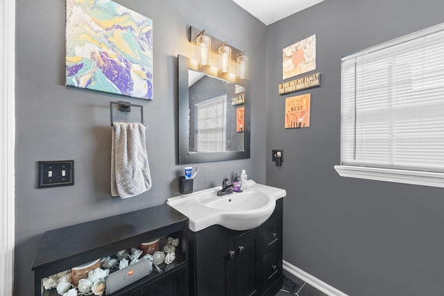 1204A Keller Ave, Nashville, TN 37216 - bathroom with tile patterned floors, a wealth of natural light, vanity, and baseboards