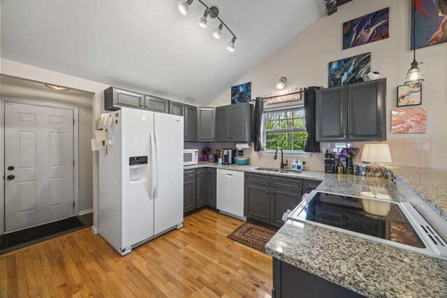 1204A Keller Ave, Nashville, TN 37216 - kitchen featuring a sink, white appliances, light wood-style floors, and lofted ceiling