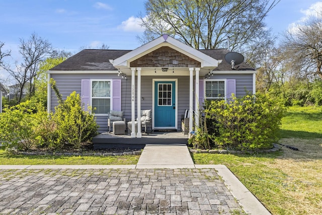 1204A Keller Ave, Nashville, TN 37216 - bungalow with a front yard, a shingled roof, and covered porch