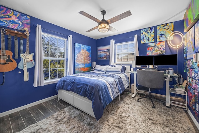 1204A Keller Ave, Nashville, TN 37216 - bedroom with baseboards, multiple windows, ceiling fan, and wood finished floors