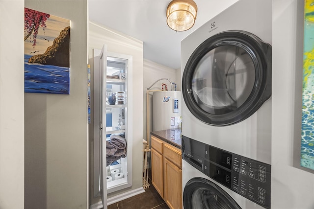 1204A Keller Ave, Nashville, TN 37216 - clothes washing area featuring water heater, dark tile patterned flooring, laundry area, and stacked washer / drying machine