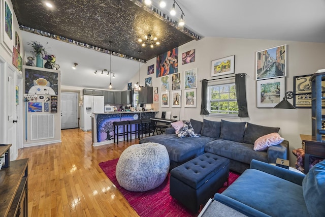 1204A Keller Ave, Nashville, TN 37216 - living room featuring light wood-type flooring and vaulted ceiling with beams