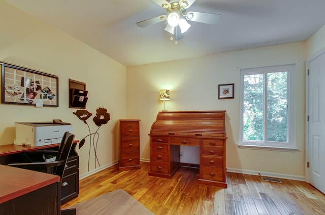 home office with light wood-style floors, a healthy amount of sunlight, a ceiling fan, and visible vents
