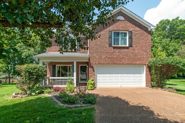 traditional-style house with an attached garage, a porch, brick siding, a front lawn, and driveway