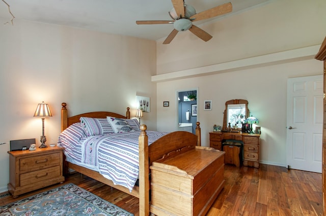 bedroom with hardwood / wood-style floors and a ceiling fan