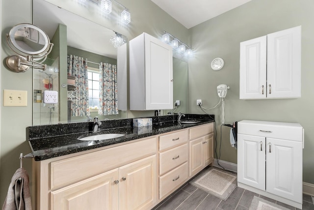 134 Joe Blanton Rd, Woodbury, TN 37190 - bathroom featuring double vanity, baseboards, and a sink