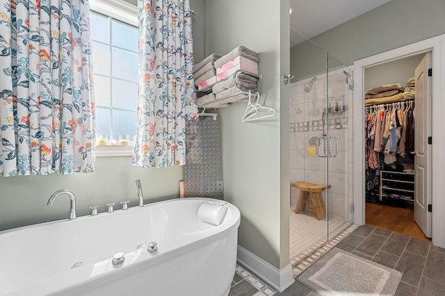134 Joe Blanton Rd, Woodbury, TN 37190 - bathroom with a shower stall, a soaking tub, and a spacious closet