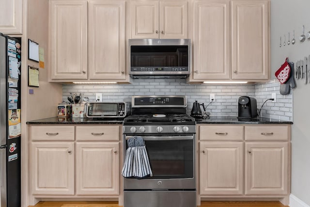 134 Joe Blanton Rd, Woodbury, TN 37190 - kitchen featuring backsplash, a toaster, dark stone counters, and stainless steel appliances