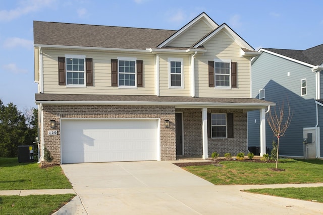 view of front of home featuring a garage, brick siding, a front lawn, and concrete driveway
