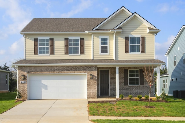 craftsman-style house with concrete driveway, a front lawn, an attached garage, and brick siding