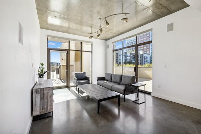 1510 Demonbreun St Unit 511, Nashville, TN 37203 - living room featuring finished concrete floors and baseboards