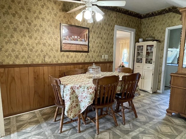 312 Neal St, Huntland, TN 37345 - dining area featuring wallpapered walls, wainscoting, and a ceiling fan