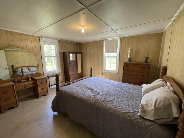 312 Neal St, Huntland, TN 37345 - bedroom with wood walls, multiple windows, and carpet floors