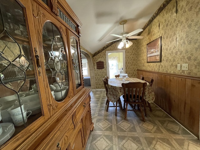 312 Neal St, Huntland, TN 37345 - dining space with arched walkways, a ceiling fan, wallpapered walls, a wainscoted wall, and lofted ceiling
