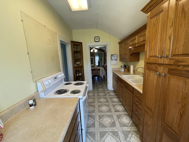 312 Neal St, Huntland, TN 37345 - kitchen featuring brown cabinetry, white range with electric stovetop, light countertops, a sink, and lofted ceiling