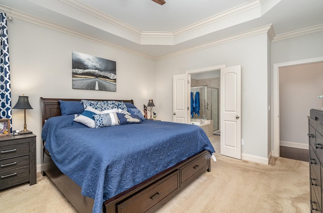 5344 Highland Place Way, Hermitage, TN 37076 - bedroom featuring light colored carpet, a tray ceiling, ornamental molding, baseboards, and ensuite bath