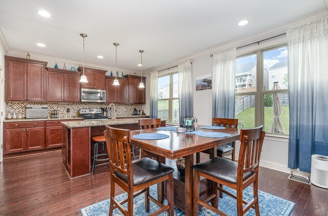 5344 Highland Place Way, Hermitage, TN 37076 - dining space featuring crown molding, dark wood-type flooring, baseboards, and recessed lighting