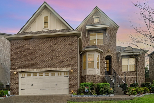 5344 Highland Place Way, Hermitage, TN 37076 - traditional-style house with brick siding, concrete driveway, a garage, and board and batten siding
