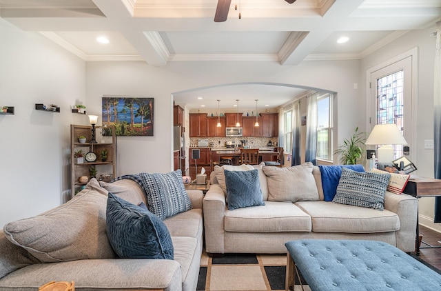 5344 Highland Place Way, Hermitage, TN 37076 - living room featuring coffered ceiling, arched walkways, beamed ceiling, a ceiling fan, and ornamental molding