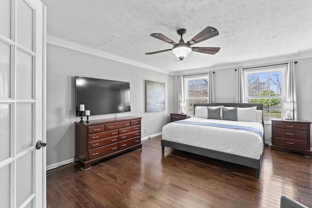 bedroom with crown molding, baseboards, dark wood-style floors, and a textured ceiling