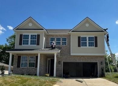traditional-style house with concrete driveway and a garage