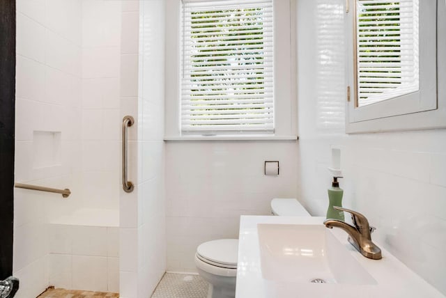 931 Caldwell Ln, Nashville, TN 37204 - full bath with tile walls, a stall shower, a sink, and toilet