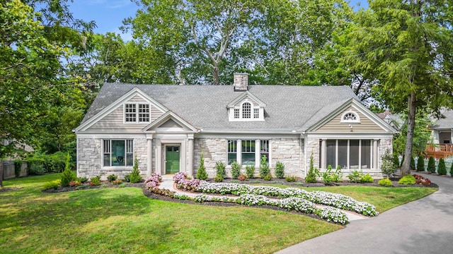 931 Caldwell Ln, Nashville, TN 37204 - view of front of house with roof with shingles, a chimney, stone siding, a front yard, and fence