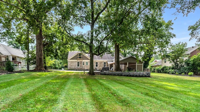 931 Caldwell Ln, Nashville, TN 37204 - back of house featuring a yard and stone siding
