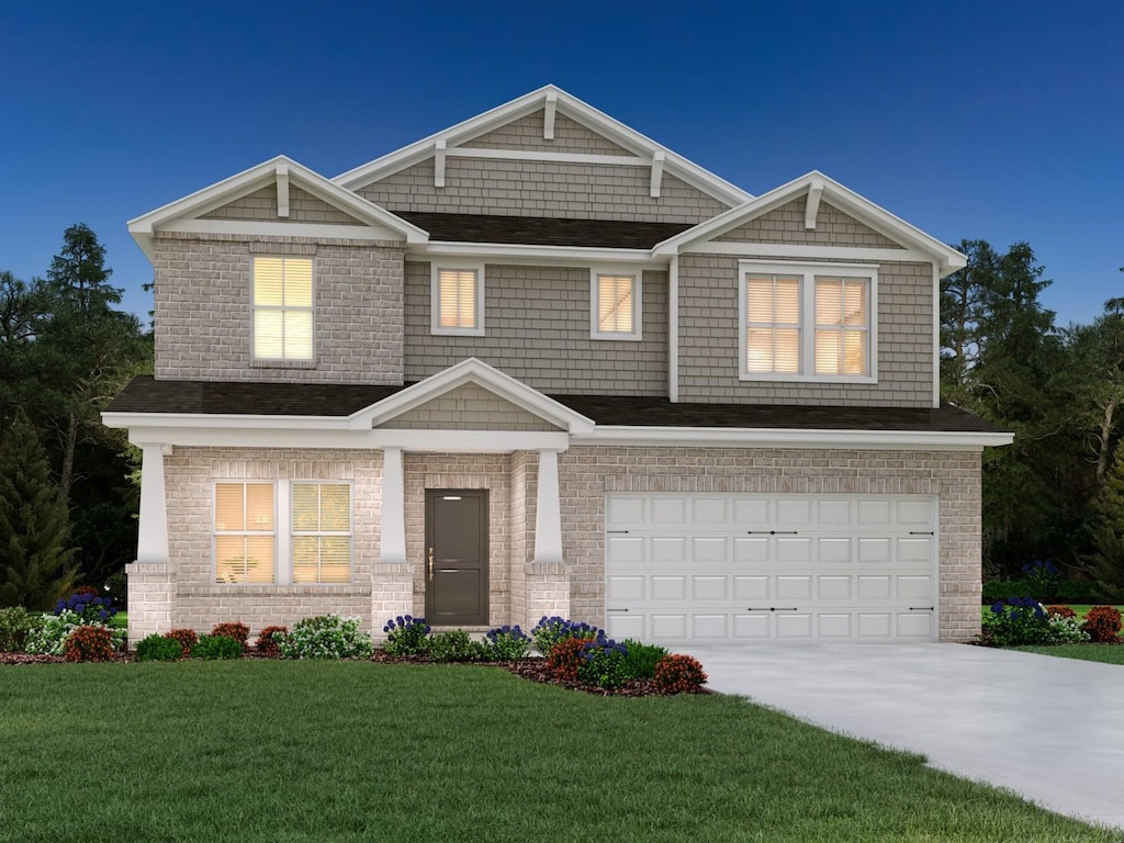 323 Zen Ct, Smyrna, TN 37167 - view of front of property with driveway, an attached garage, and a front lawn