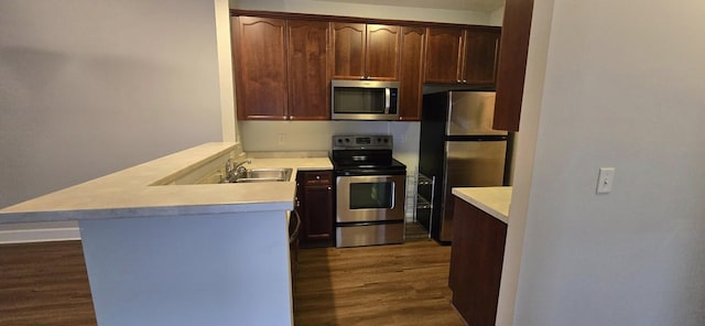 8047 Bienville Dr Unit X6, Nashville, TN 37211 - kitchen with stainless steel appliances, a peninsula, dark wood-style floors, and light countertops