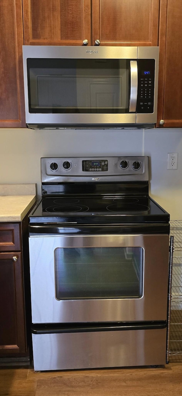 8047 Bienville Dr Unit X6, Nashville, TN 37211 - kitchen with stainless steel appliances, light countertops, and wood finished floors