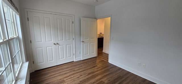 8047 Bienville Dr Unit X6, Nashville, TN 37211 - unfurnished bedroom with dark wood-style floors, a closet, and baseboards
